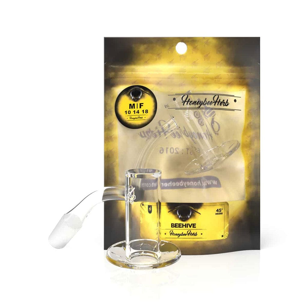 Front-facing shot of the Honeybee Herb Beehive Quartz Banger - 45° Degree | Yl set against its gold-and-black branded packaging, showing the clear glass banger’s angled neck and wide round base.