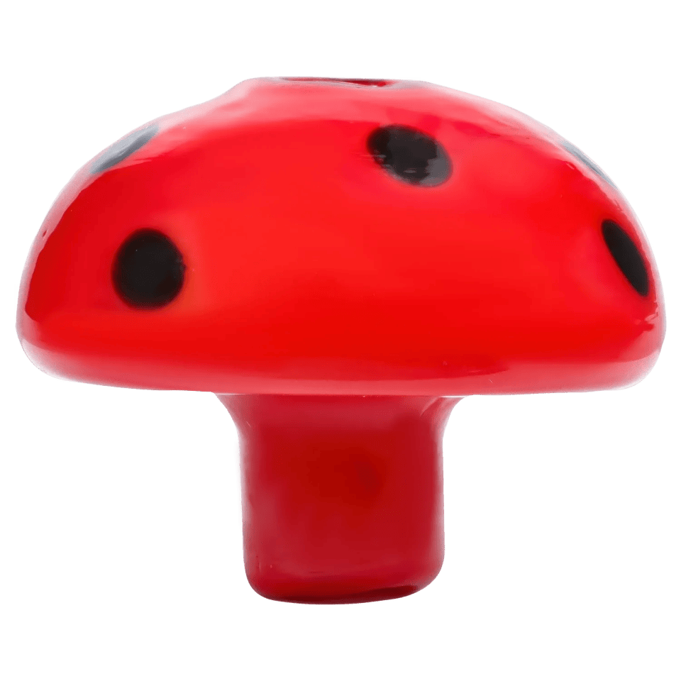 Close-up front view of a glossy red DHC Assorted Mushroom Carb Cap - Assorted colors with black spots on a white background