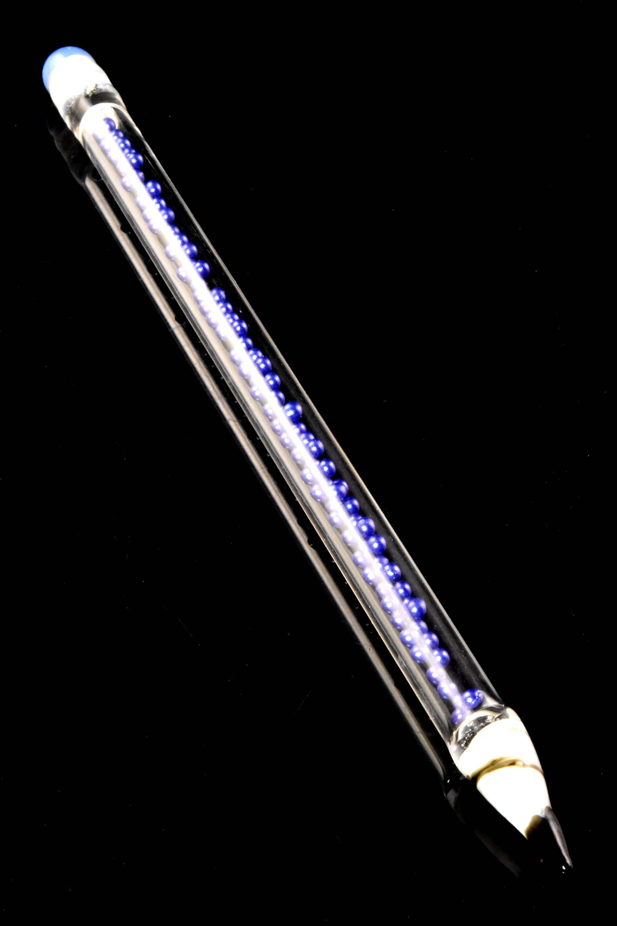 Diagonal close-up of the Primate Glass Bead Pencil Dab Tool – 6″ showing a clear glass shaft filled with a row of purple beads.
