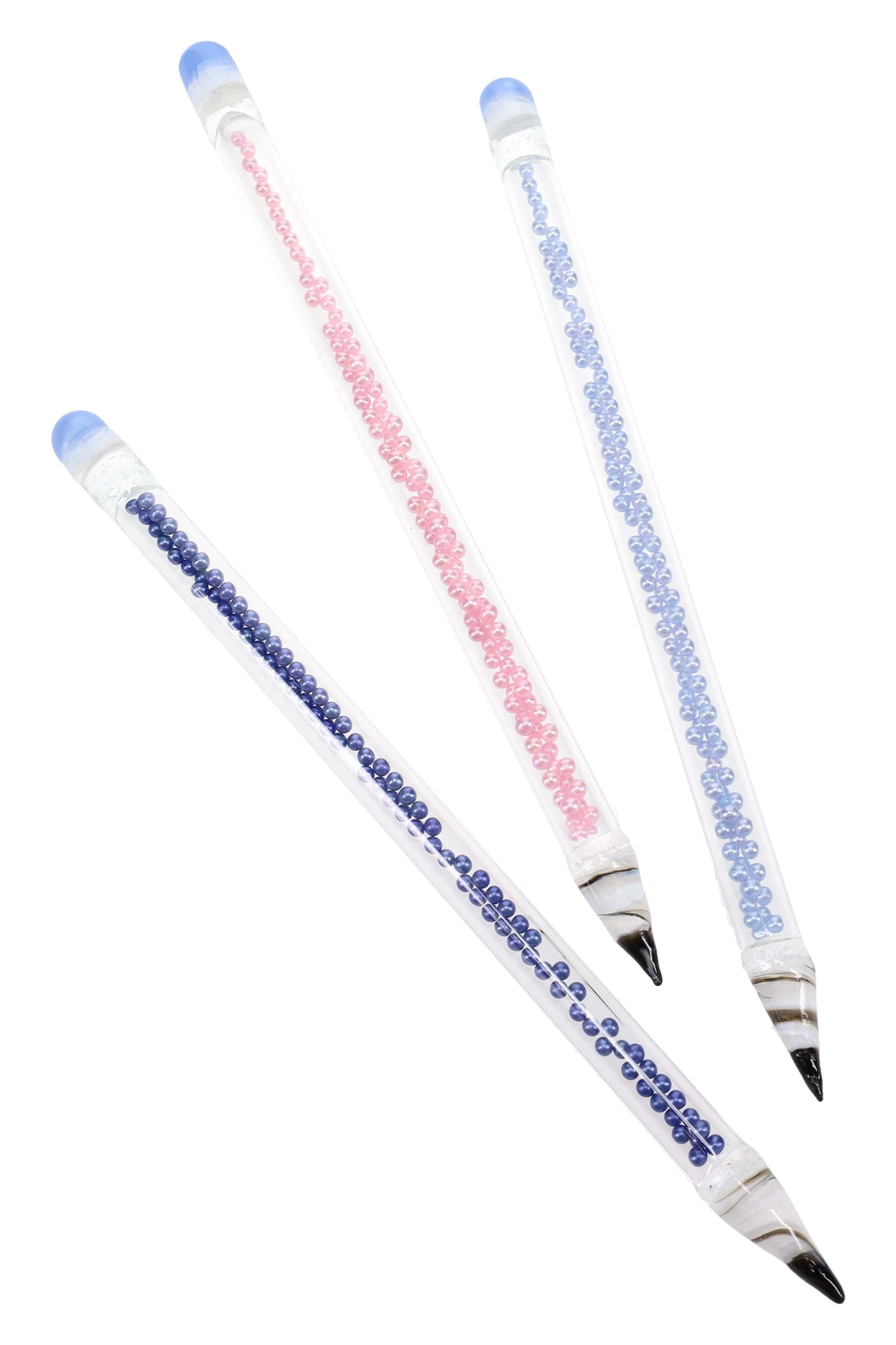 Diagonal close-up of three clear glass Primate Glass Bead Pencil Dab Tool – 6″ rods showing internal blue and pink bead rows and rounded blue tips.