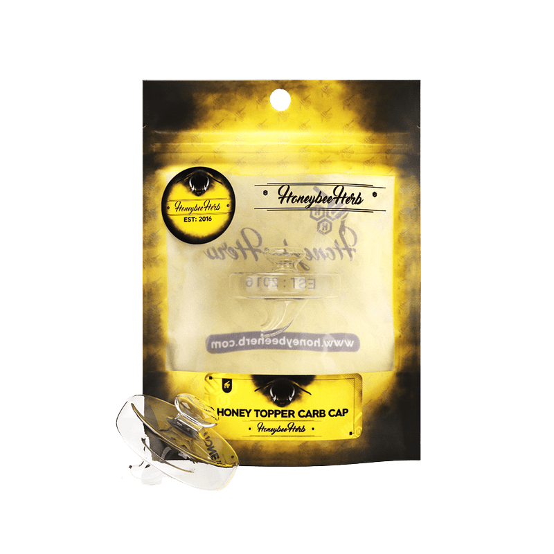 Front view of the Honeybee Herb Honey Topper Carb Cap packaging with the clear glass carb cap shown at the lower left.