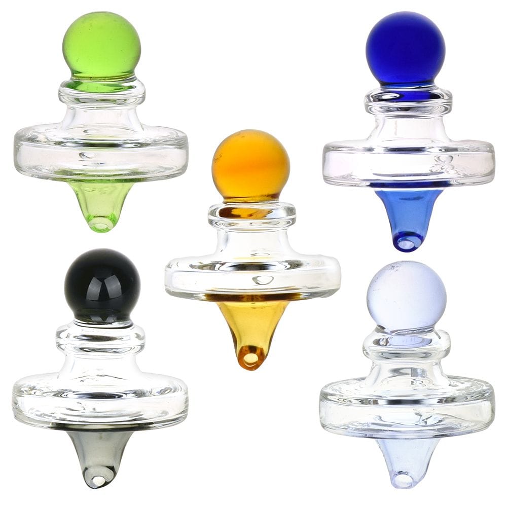 Top-down view of five colorful Pulsar Ufo Directional Carb Cap - 35Mm / Colors Vary pieces arranged on white background, showing green, amber, blue, black, and pale lavender glass tops.