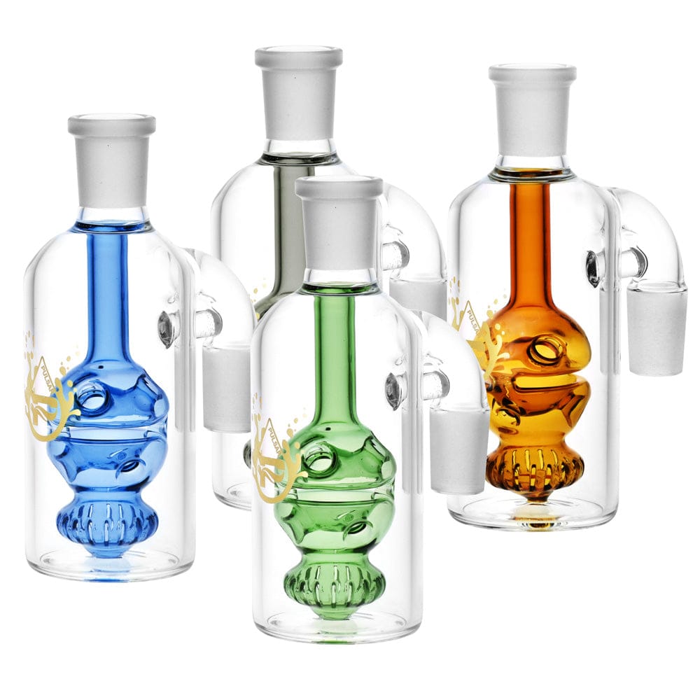 Front-facing cluster of four Pulsar Egg Perc Ash Catcher - 90 Degree / Colors Vary pieces showing blue, green, amber, and clear glass inner egg percs inside cylindrical outer chambers.