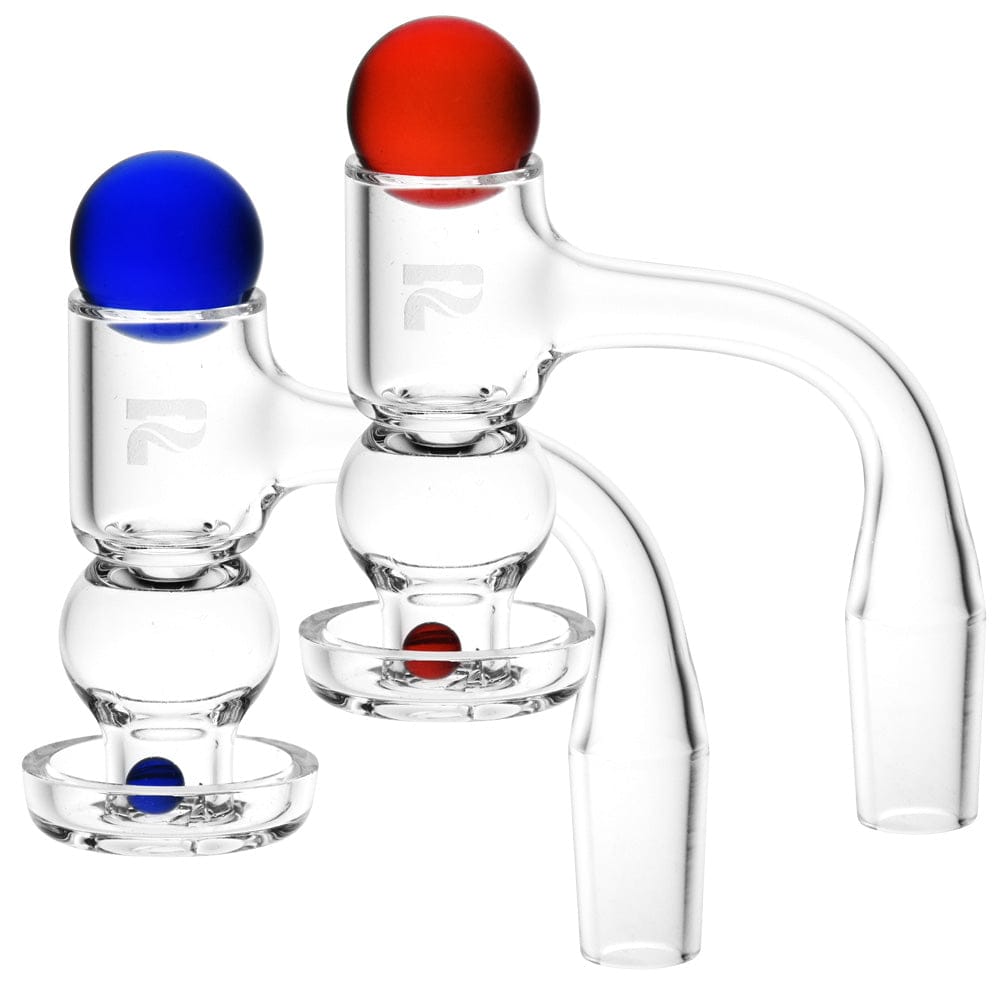 Close-up of two Pulsar Quartz Terp Slurper Hybrid Set - 14Mm M / Colors Vary pieces on a white background, one topped with a red ball and one with a blue ball.