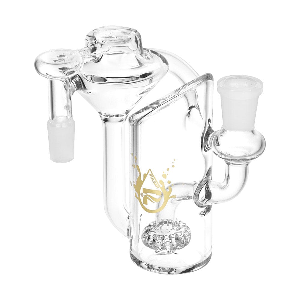 Angled close-up of the clear Pulsar Alchemist Recycler Ash Catcher | 14Mm | 5" | Colors Vary showing its U-shaped chamber, gold logo, and frosted 14mm joints.