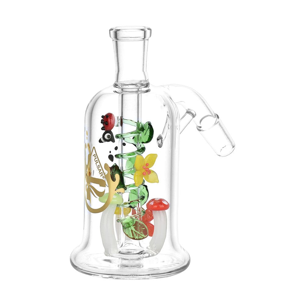 Front-facing view of the Pulsar Trippy Garden Ash Catcher | 14Mm showing a clear glass chamber with colorful internal glass flowers, a ladybug and mushroom accents.