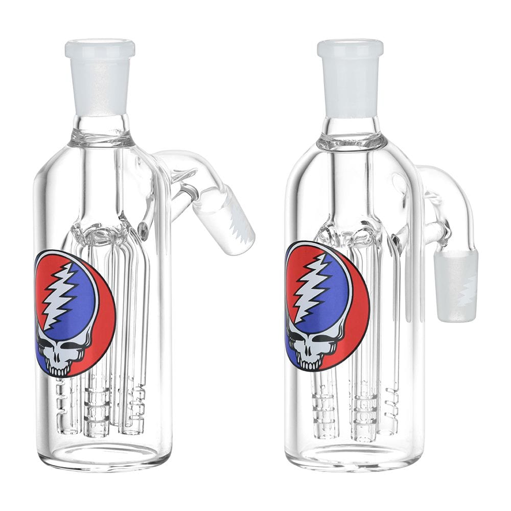 Front-facing 45 degree view of two clear glass Grateful Dead X Pulsar Syf Ash Catcher 14Mm M To 14Mm F pieces with red‑and‑blue skull logos and internal tree percolators.