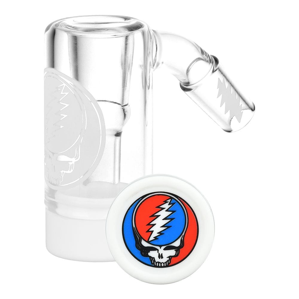Close-up three-quarter view of the Grateful Dead X Pulsar Steal Your Face Reclaim Kit | 14Mm showing clear glass parts and a round white reclaim lid with the red‑blue lightning skull logo.