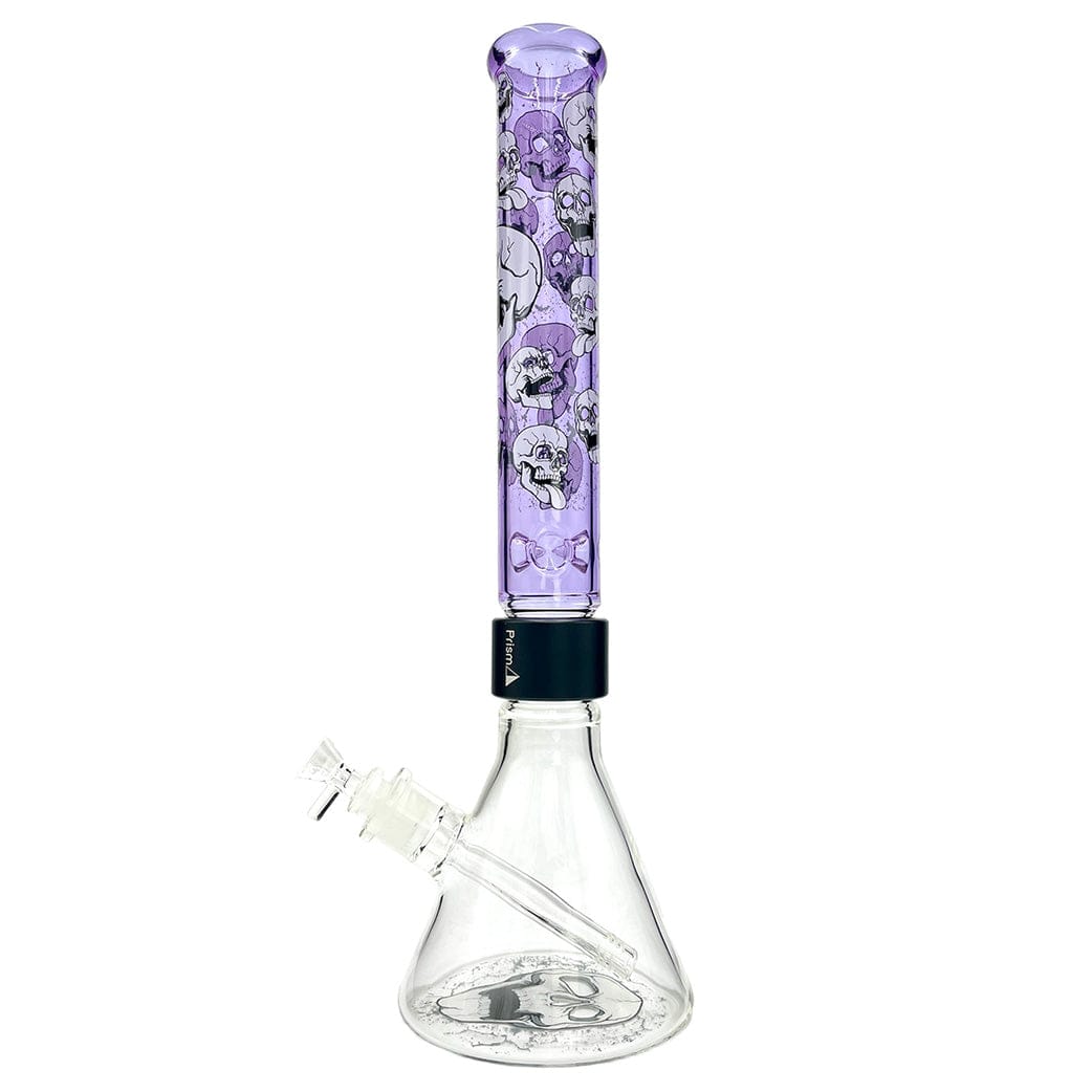 Straight-on view of the Prism Prism Skull Beaker Single Stack showing a clear beaker base with a tall translucent purple skull-patterned tube stacked above a black band.