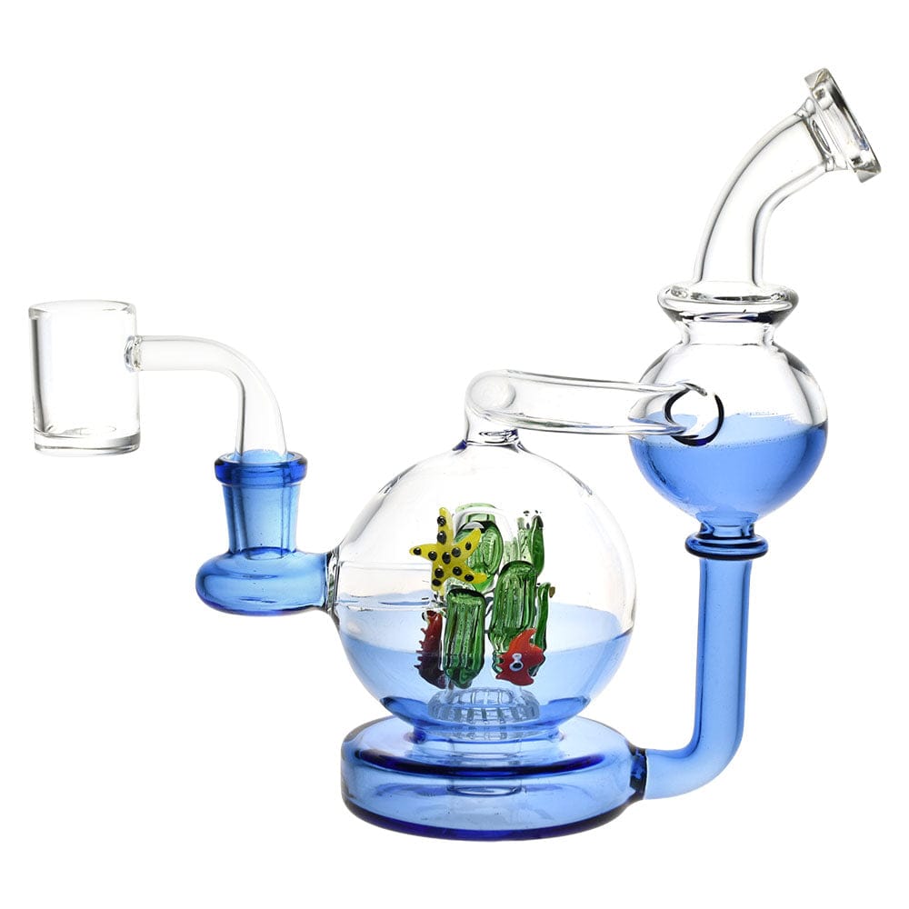 Front-angle view of the Pulsar Sea Globe Recycler Dab Rig - 7" / 14Mm F showing a clear glass globe with blue accents and a tiny multicolored coral scene inside.