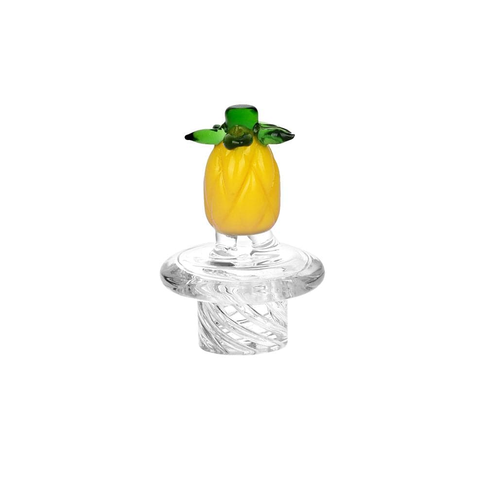 Centered front view of a small yellow pineapple topper on a clear glass joint piece, the Pulsar Fruit Series Pineapple Express Glow In The Dark Dab Rig Kit - 8" / 14Mm F shown against a white background