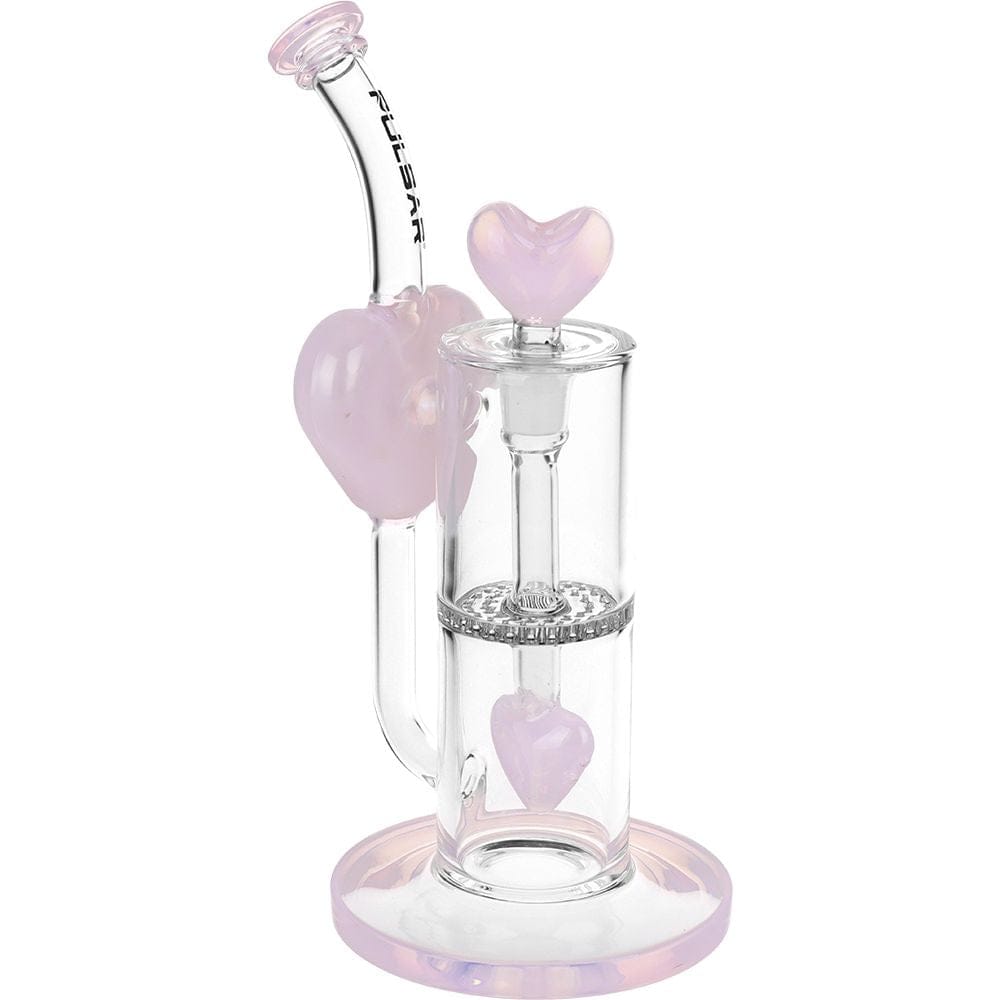Front three-quarter view of the Pulsar Hearts On Hearts Recycler Water Pipe - 8.25" / 14Mm F showing clear glass chambers, pink heart accents, and a curved mouthpiece against a white background
