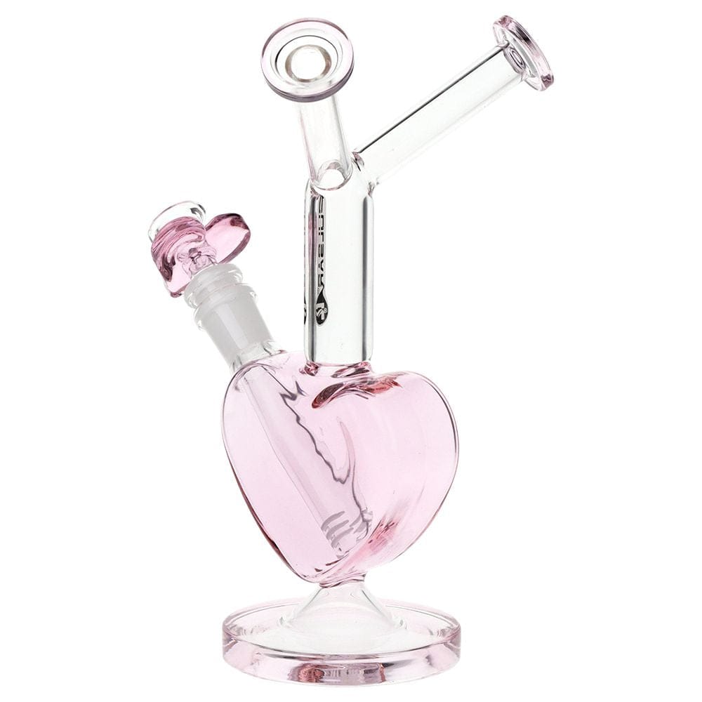 Angled front view of the Pulsar Double Kiss Heart Glass Water Pipe - 11" / 14Mm F, showing its pink heart-shaped base, angled necks, and clear glass mouthpiece on a white background