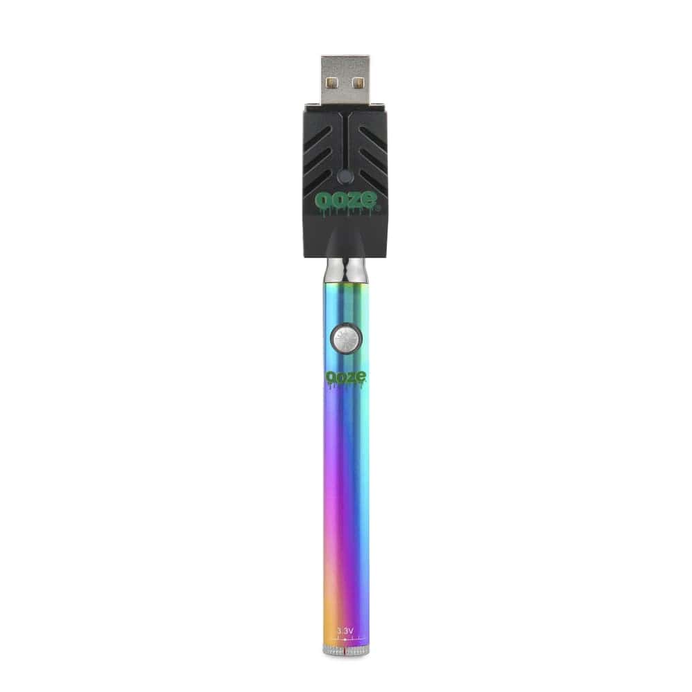 Centered front view of the Ooze Slim Twist 510 Thread 320 mAh CBD Vape Pen Battery + USB Charger showing the rainbow metallic battery attached to a black USB charger on a white background.