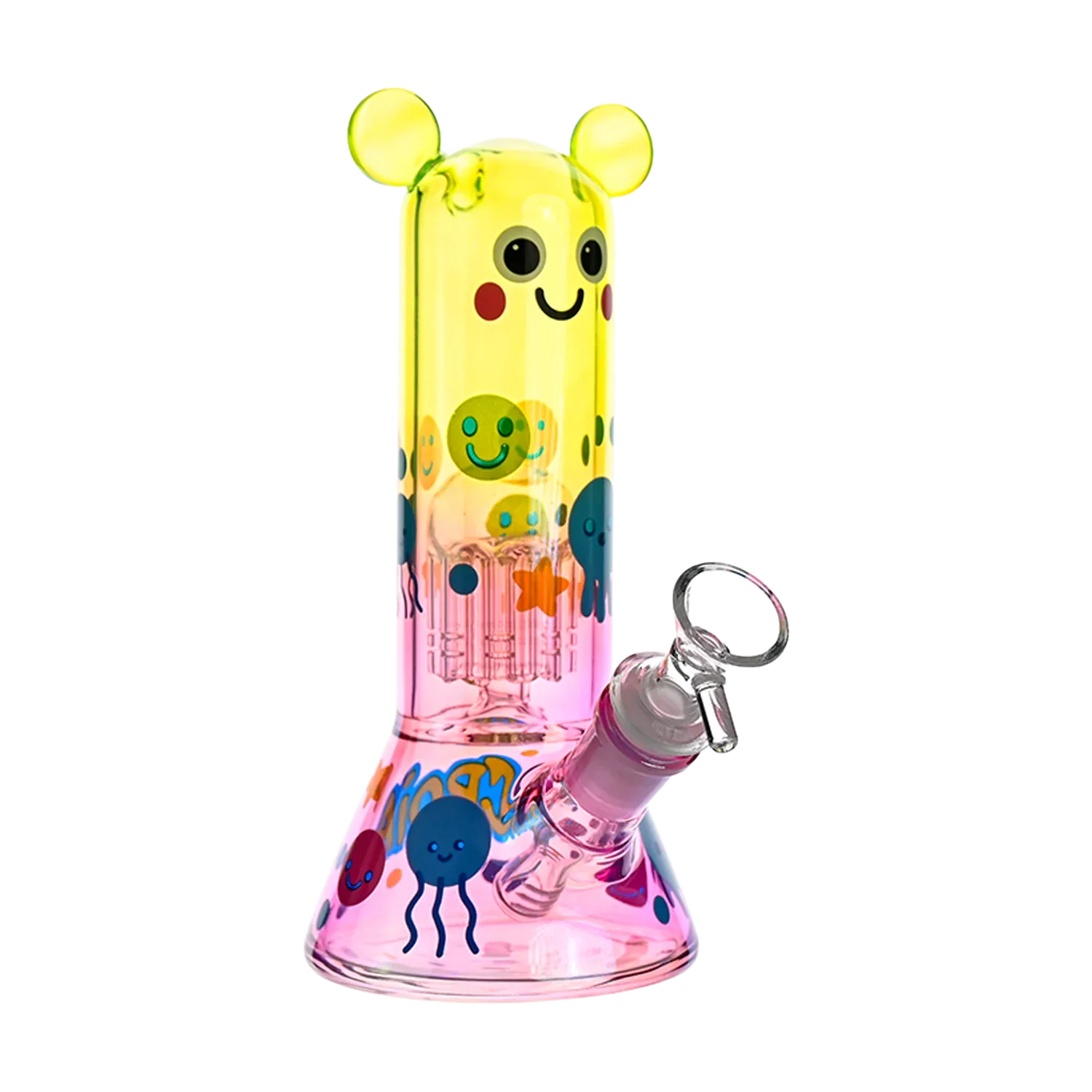 Close-up front view of the Croia Glass Cute Character Beaker Bong with Jellyfish Design showing its yellow smiling top section with ear-like knobs and pink base decorated with colorful jellyfish.