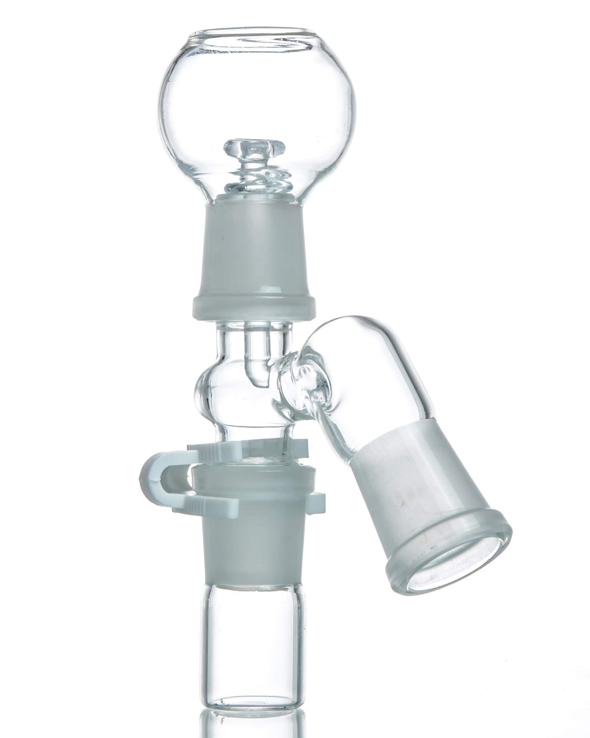A close-up, angled view of the Reclaim Catcher, showing its clear glass construction and cylindrical shape.