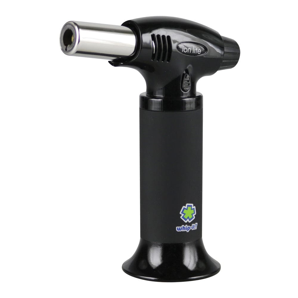 Side view of the Whip-It! Ion Lite Torch Lighter in matte black showing its upright cylindrical base, angled metal nozzle, and small logo near the bottom.