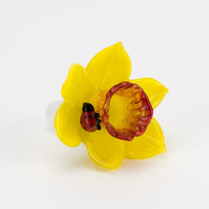 Front view of the Daffodil Bowl Piece, a yellow glass piece with a rounded shape and visible interior details.