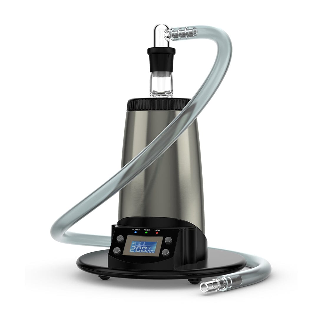 Front three-quarter view of the stainless steel Arizer V-Tower Desktop Vaporizer with coiled clear hose and digital display on a white background
