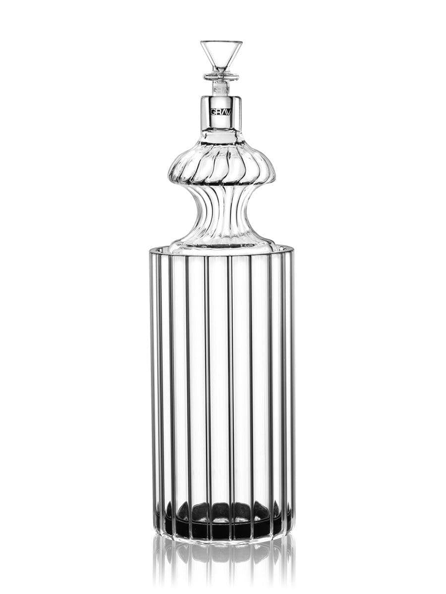 Front view of the Monarch Gravity Bong, a clear glass piece with vertical ridges, reflected on a glossy black surface.