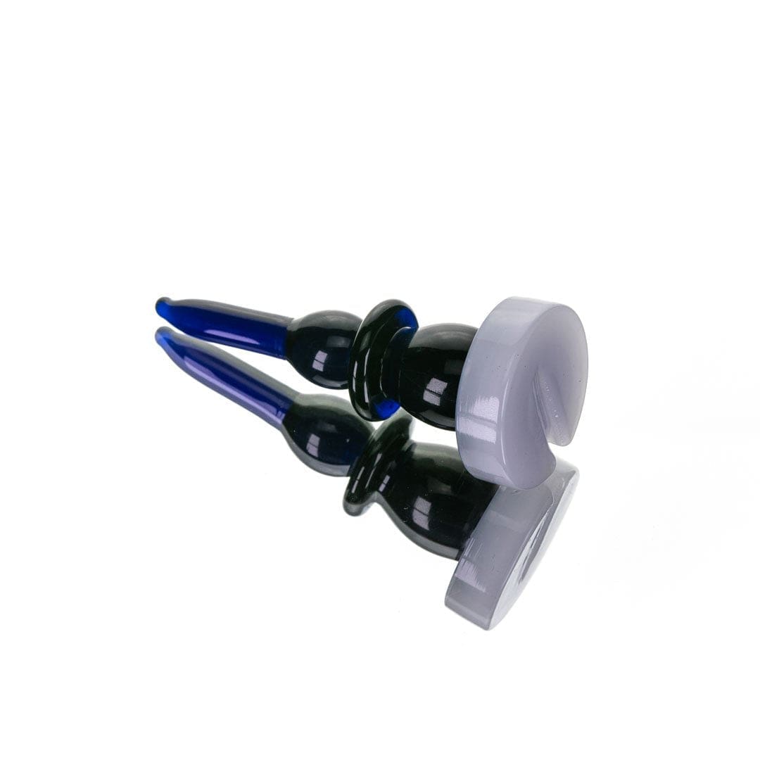 A slightly angled view of The Bishop Directional Carb Cap + Dab Tool, showcasing its reflective surface against a plain white background.