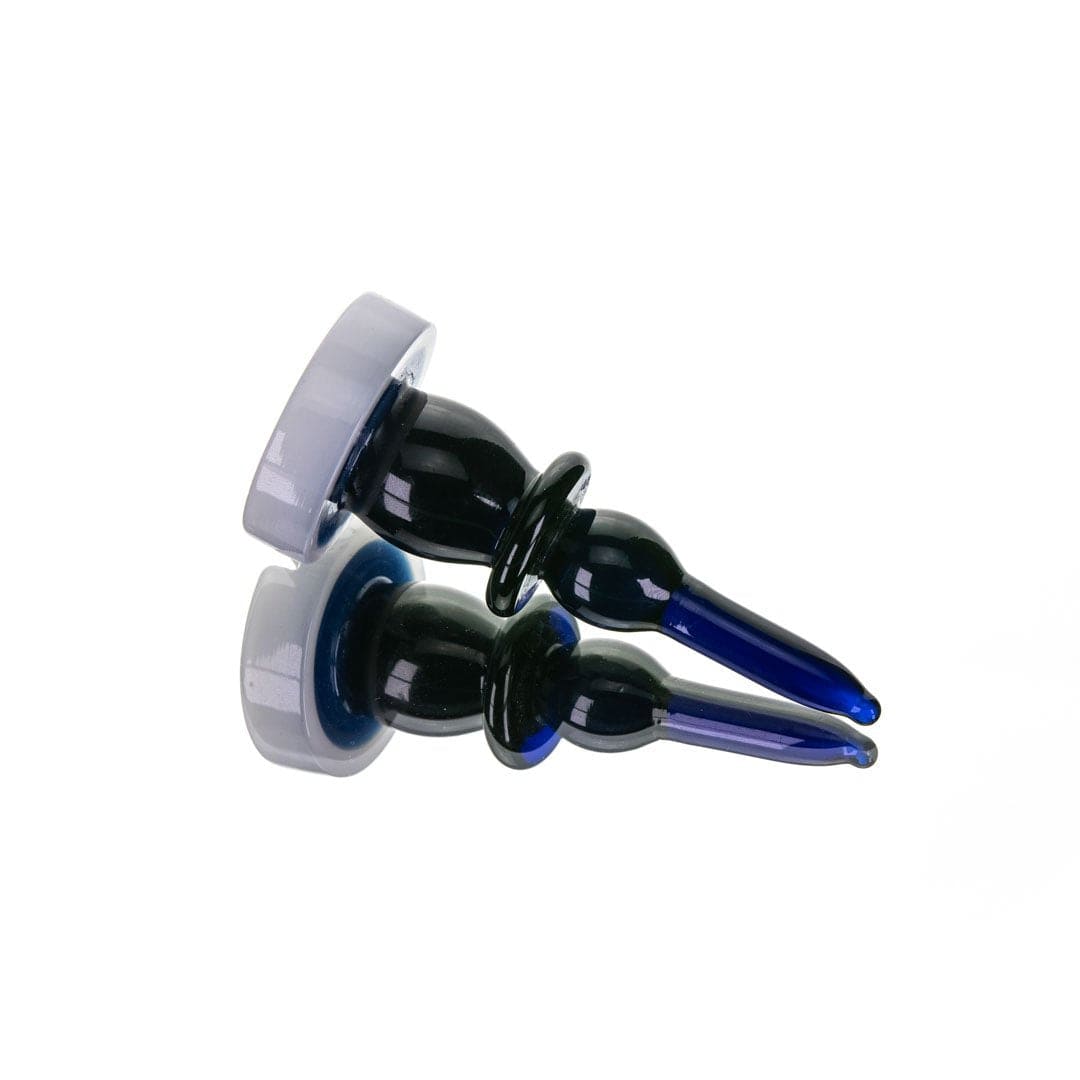 A slightly angled overhead view showcases The Bishop Directional Carb Cap + Dab Tool, featuring a sleek, dark blue design.