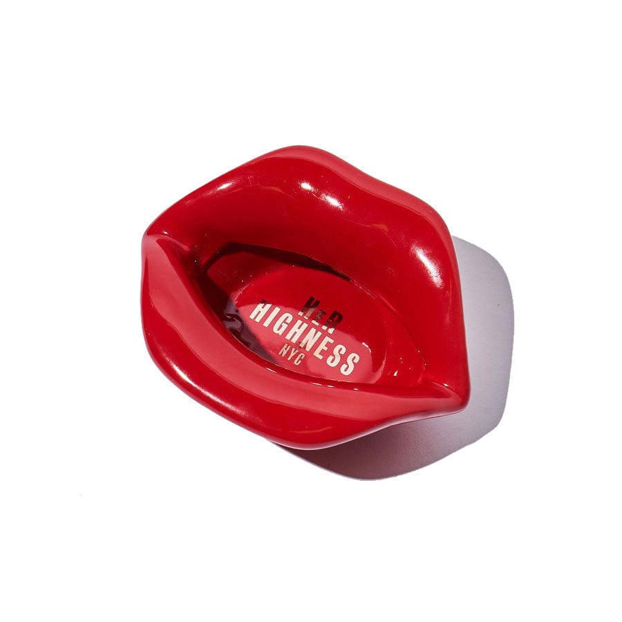 A top-down view of the Lip Service Ashtray, featuring a glossy, red lip-shaped design.