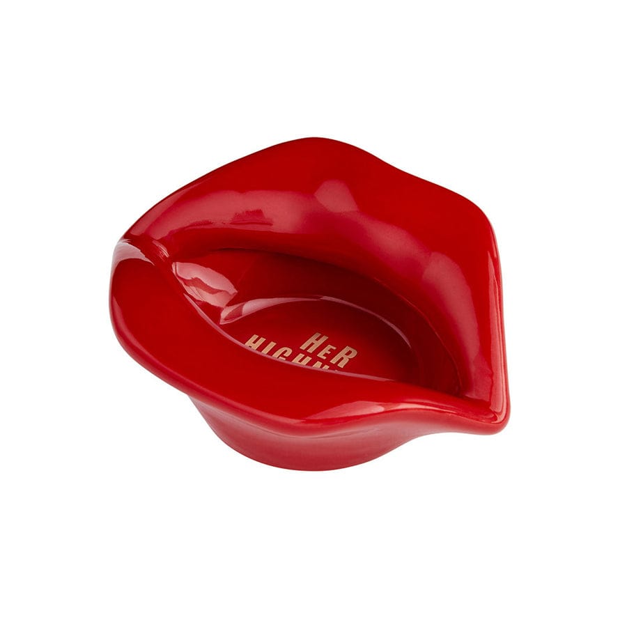 A close-up of the Lip Service Ashtray, showcasing its glossy, red lip-shaped design against a plain white background.