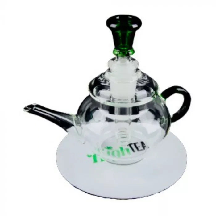 Top-down view of a clear glass High Tea Bubbler teapot with a green-tinted mouthpiece and black handle resting on a white circular mat.