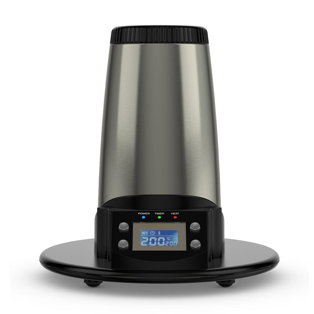 Front view of the stainless steel Arizer V-Tower Desktop Vaporizer standing on its round black base with a lit blue digital display.