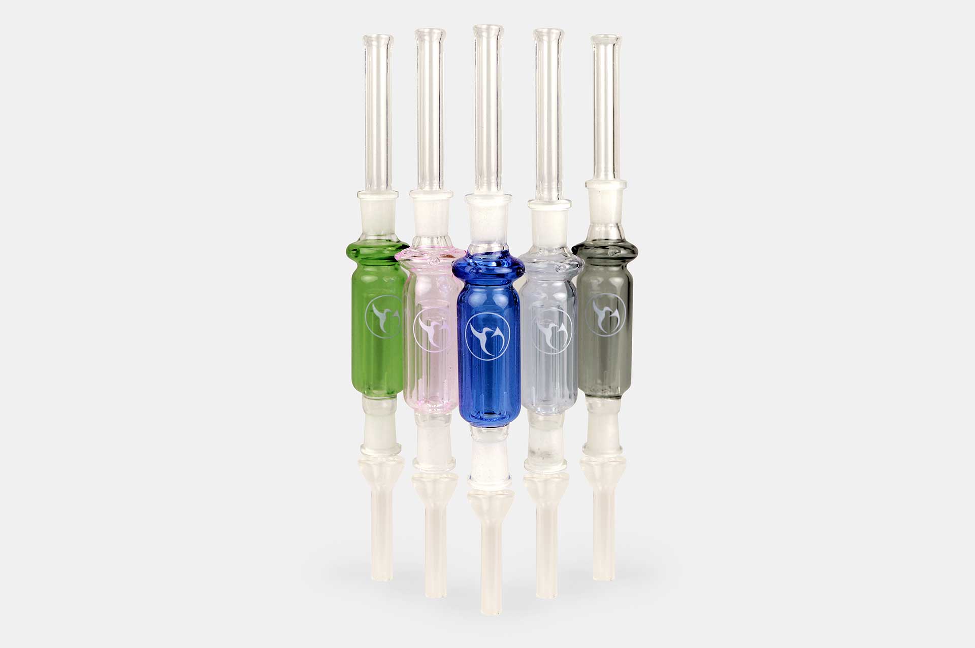 Row of five upright Nectar Collector Wildbird Kit glass tips in green, pink, blue, clear, and charcoal centered on a white reflective background.