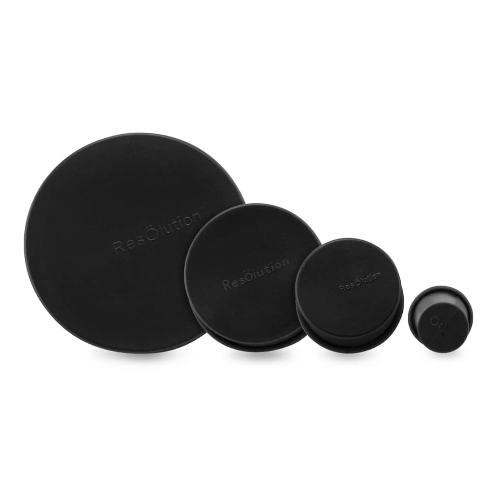 Front-facing row of four black round Ooze Resolution Caps in graduated sizes on a white background.