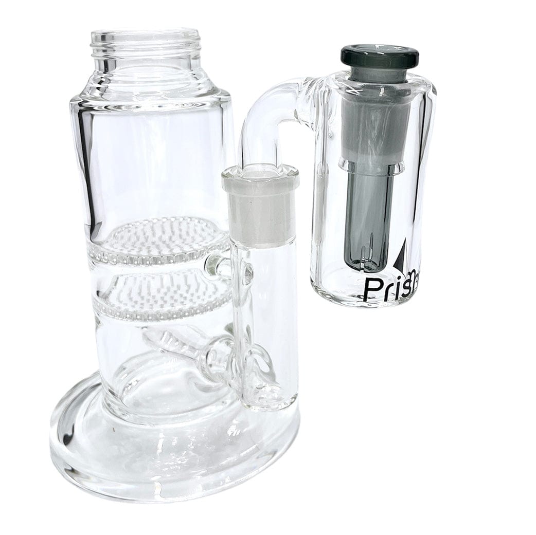 Front three-quarter view of the Prism Honeycomb Base Ash Catcher showing clear glass dual honeycomb percolators and a detachable slime-colored side chamber against a white background