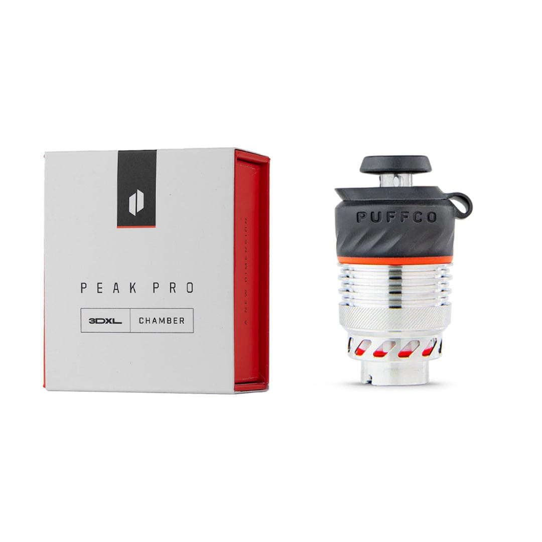 Right-side view of the Puffco Peak Pro 3D XL Chamber Atomizer standing next to its white and red branded box on a white background.