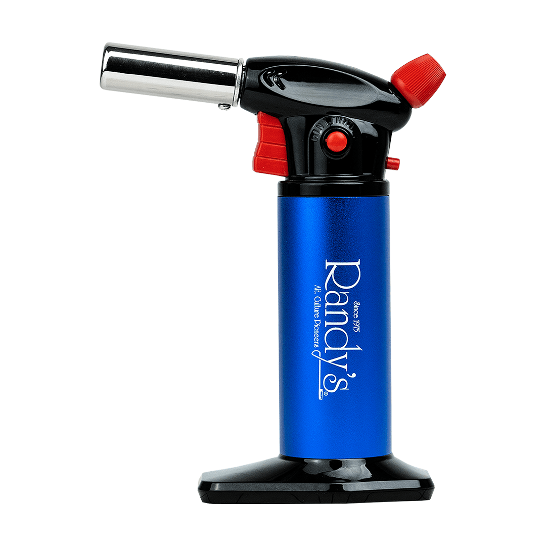 A close-up shows Randy's Torch with a silver body and red nozzle, angled slightly upward against a plain white background.