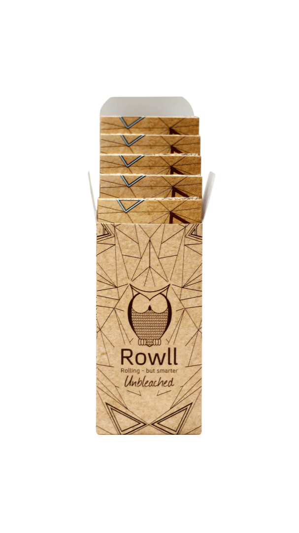 Front view of the Unbleached All in One Rolling Paper Kit w/ Grinder, showing its compact packaging in a clean, minimalist style.
