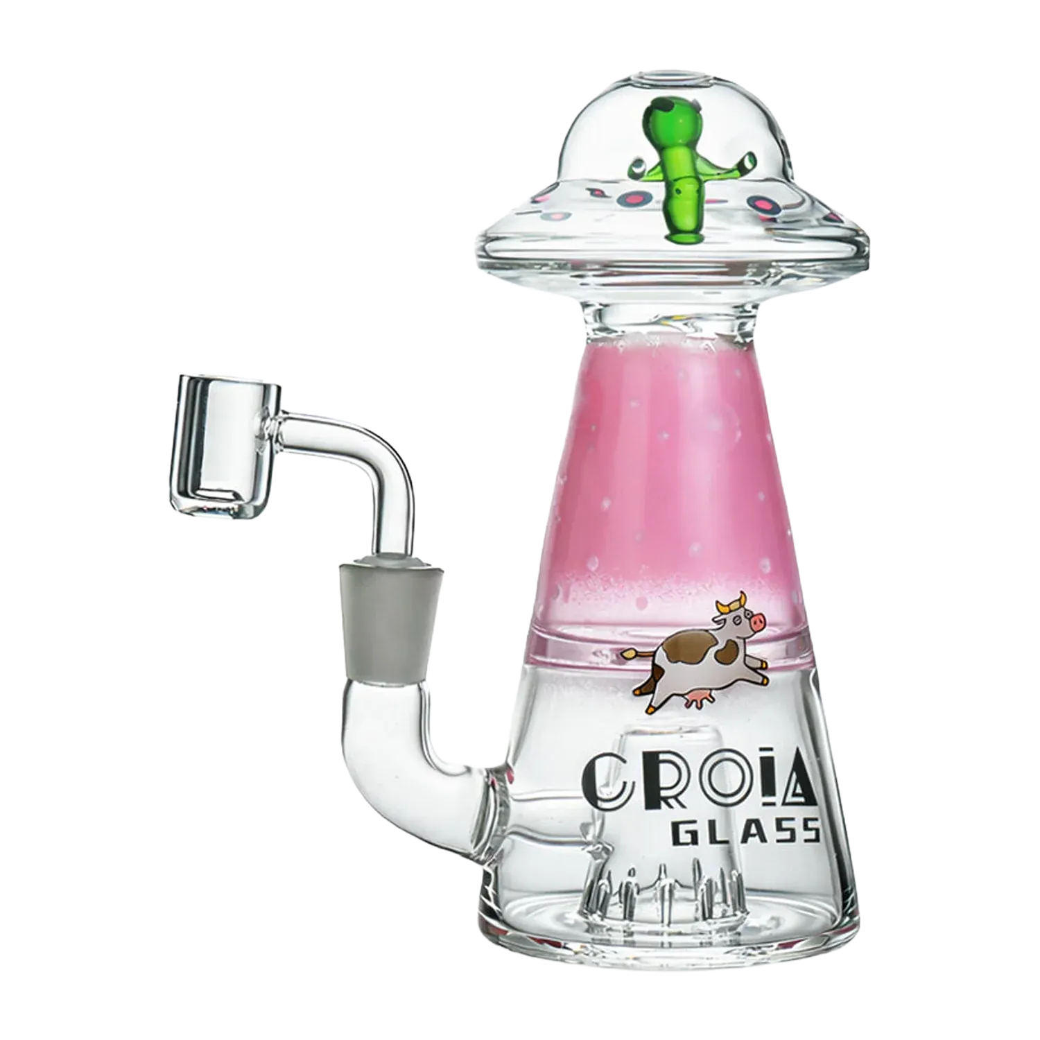 Three-quarter view of the Croia Glass UFO Alien Dab Rig with Showerhead Perc showing a clear glass body with a pink cone chamber, cartoon cow decal, and a green alien under a domed UFO top.