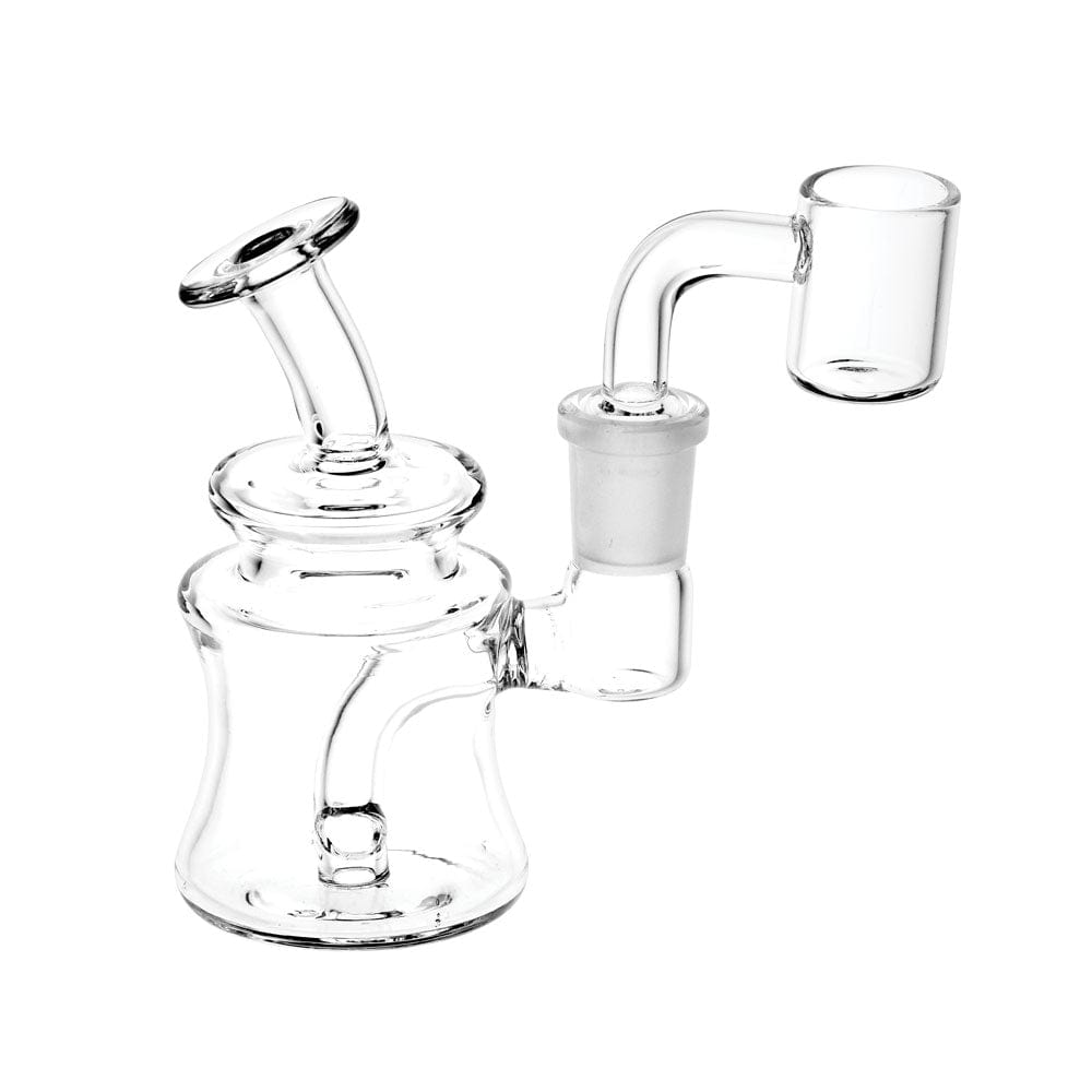 A close-up, angled view of the Clear Glass Mini Dab Rig, showcasing its small size and clear glass construction.