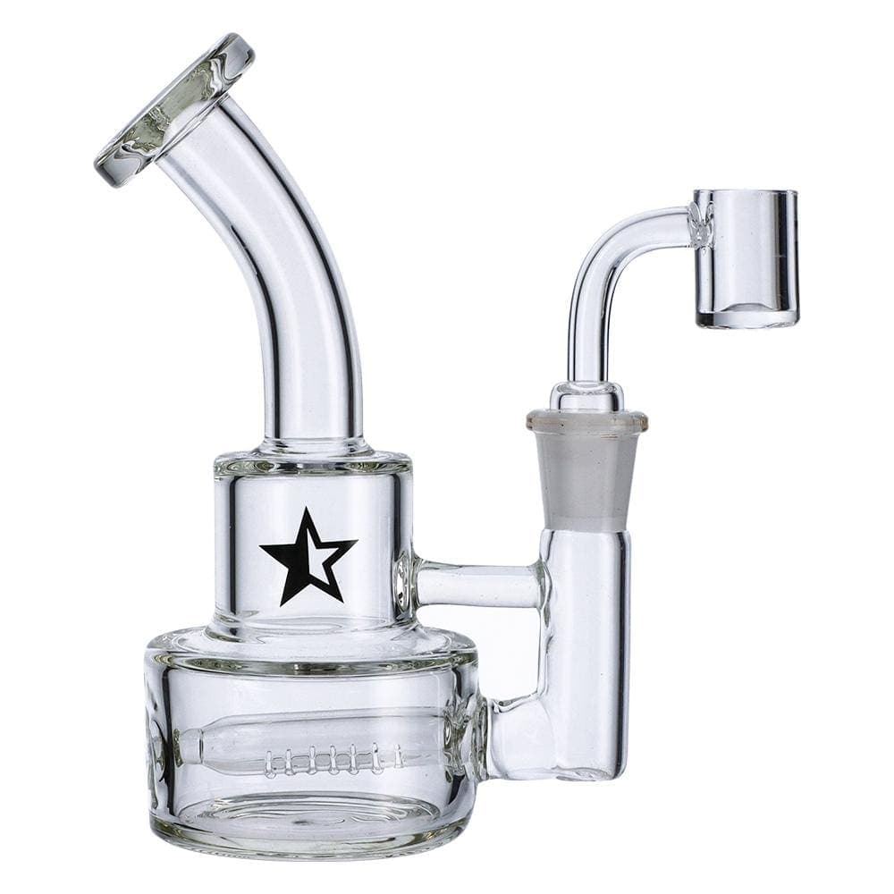 A three-quarter view of the Famous X 6" Stack Dab Rig, showing the clear glass construction and stacked perc design.
