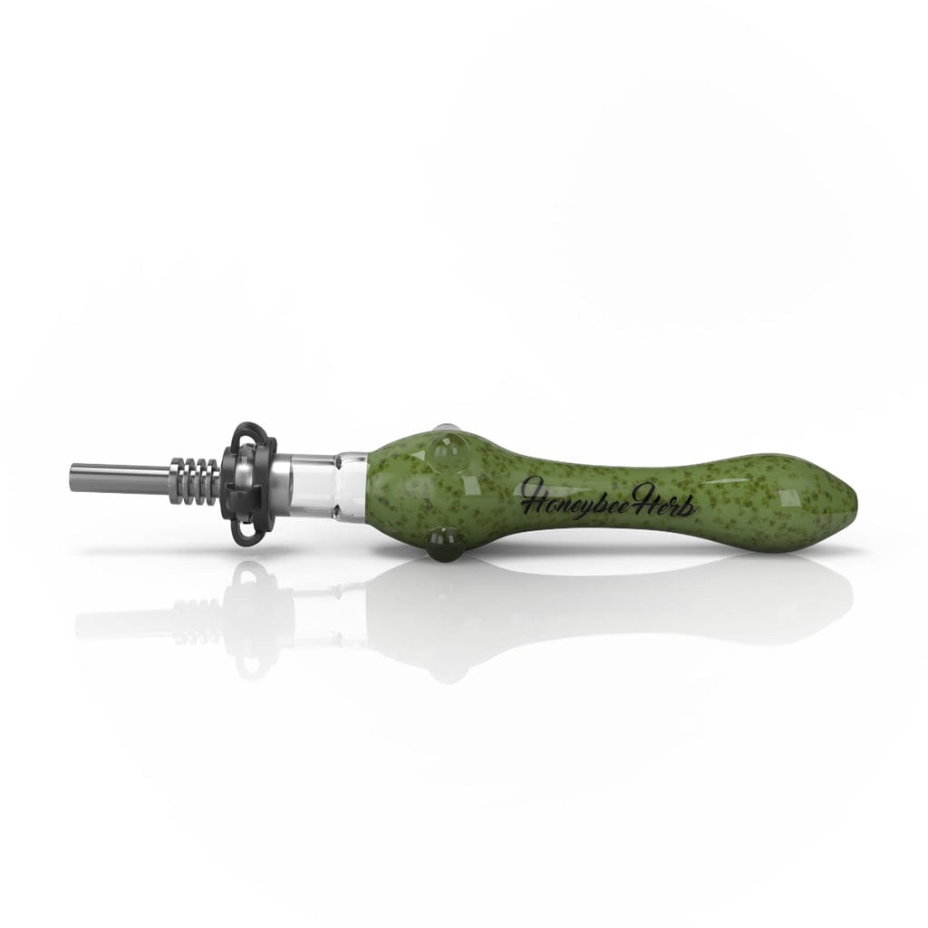 Side view of a blue Speckled Glass Nectar Collector with a speckled green glass body and metal tip resting on a white reflective surface.