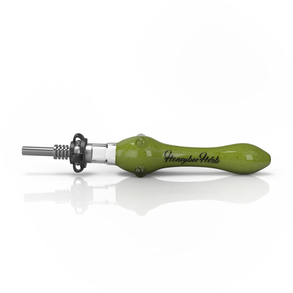 Side view of the Speckled Glass Nectar Collector with a glossy yellow-green speckled glass body and metal tip resting on a white reflective surface.