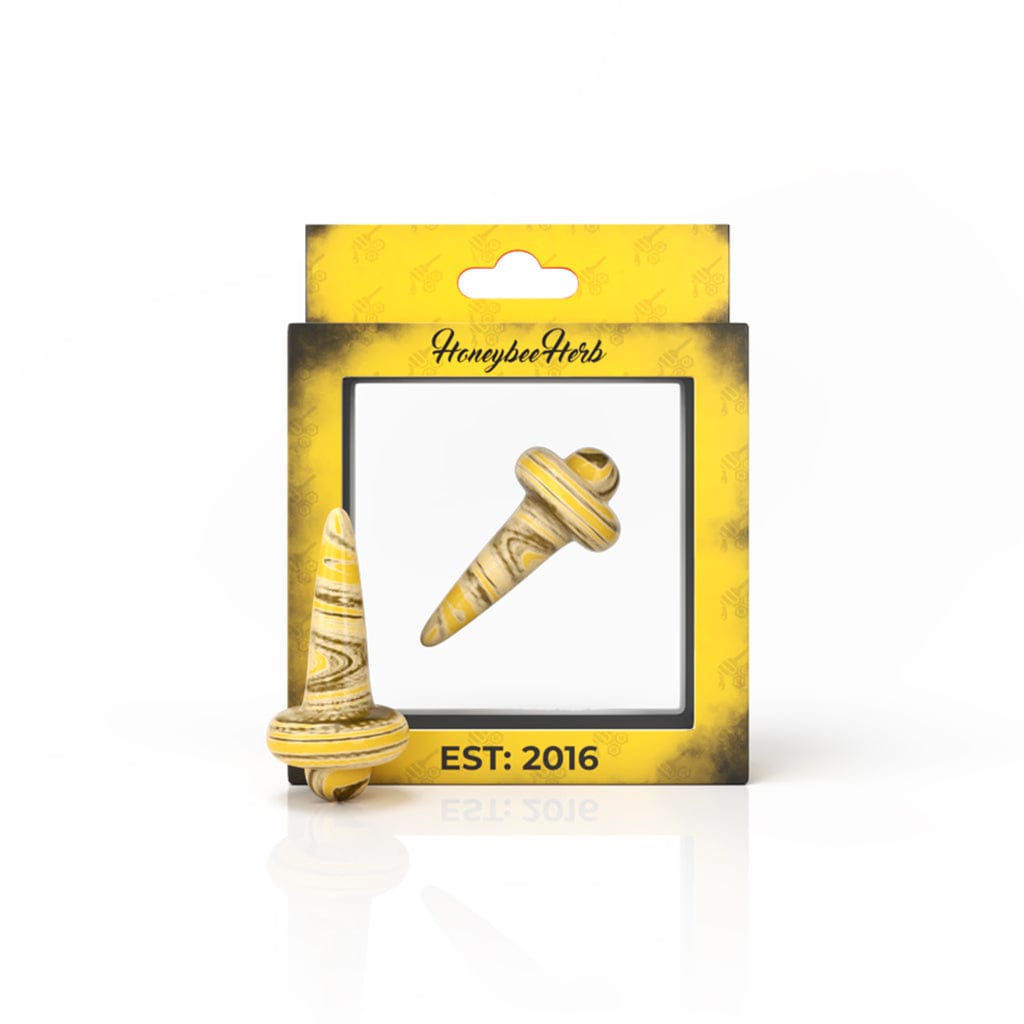 A close-up, angled view of the HONEY DIRECTIONAL CARB CAP, showing its smooth, rounded shape and glossy finish.