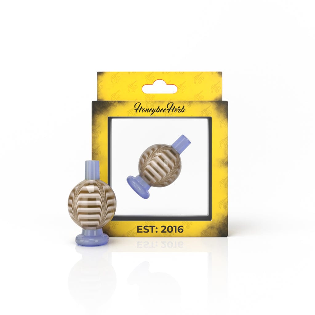 The RIBBON BUBBLE CARB CAP is displayed as a close-up, angled shot of the translucent, rounded cap against a plain white background.