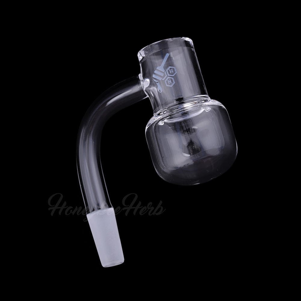 Angled close-up of the Honey Kettle Quartz Banger - 90Â° Degree | Yl showing its clear glass 90-degree neck and rounded bucket against a black background.