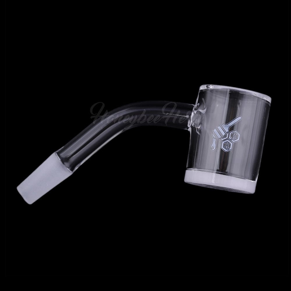 A 45-degree angled view of the HONEY & MILK BEVEL QUARTZ BANGER, showcasing its clear, glass construction and beveled edge.
