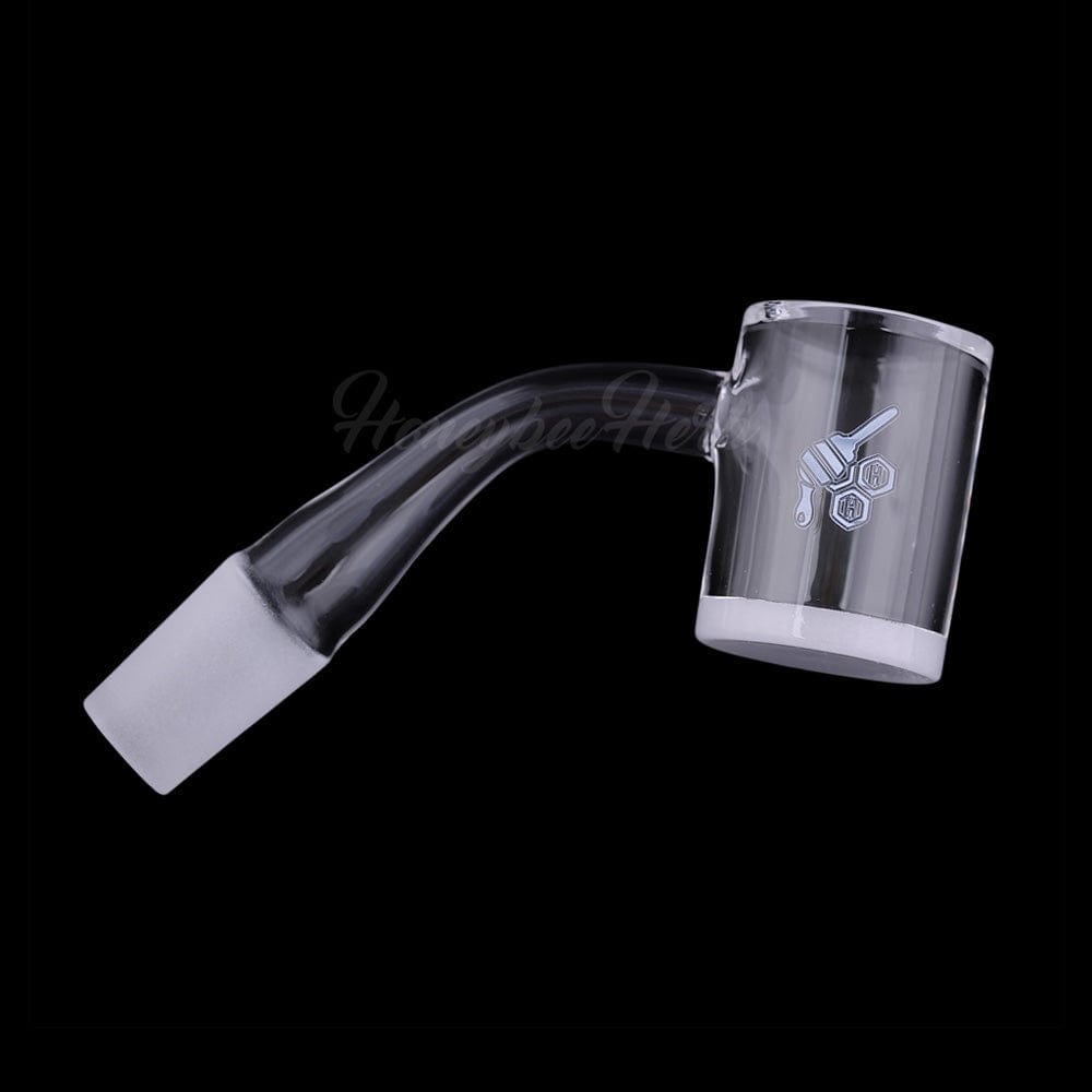 A 45-degree angled view of the HONEY & MILK BEVEL QUARTZ BANGER, showing its clear glass construction and smooth, beveled edges.