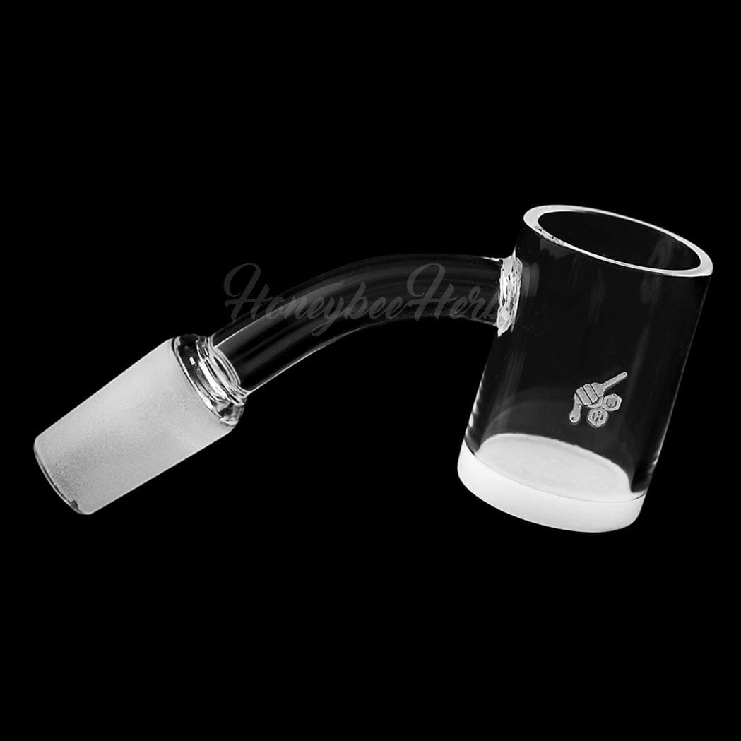 A 45-degree angled view of the HONEY & MILK QUARTZ BANGER, showcasing its clear quartz construction and smooth, rounded shape.