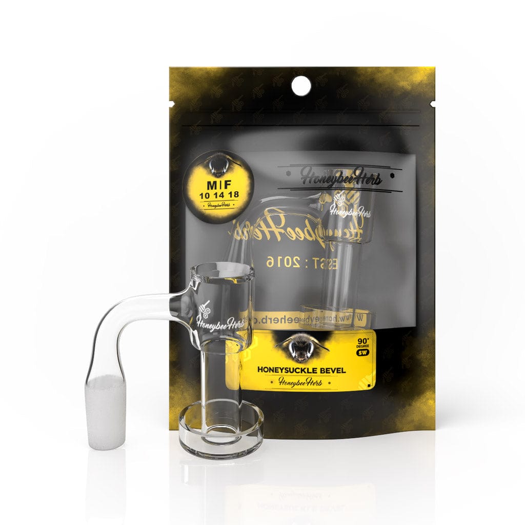 Front three-quarter view of a clear Honeysuckle Bevel Quartz Banger - 90° Degree | Bl sitting upright in front of its black and yellow branded pouch, lit with soft studio lighting.