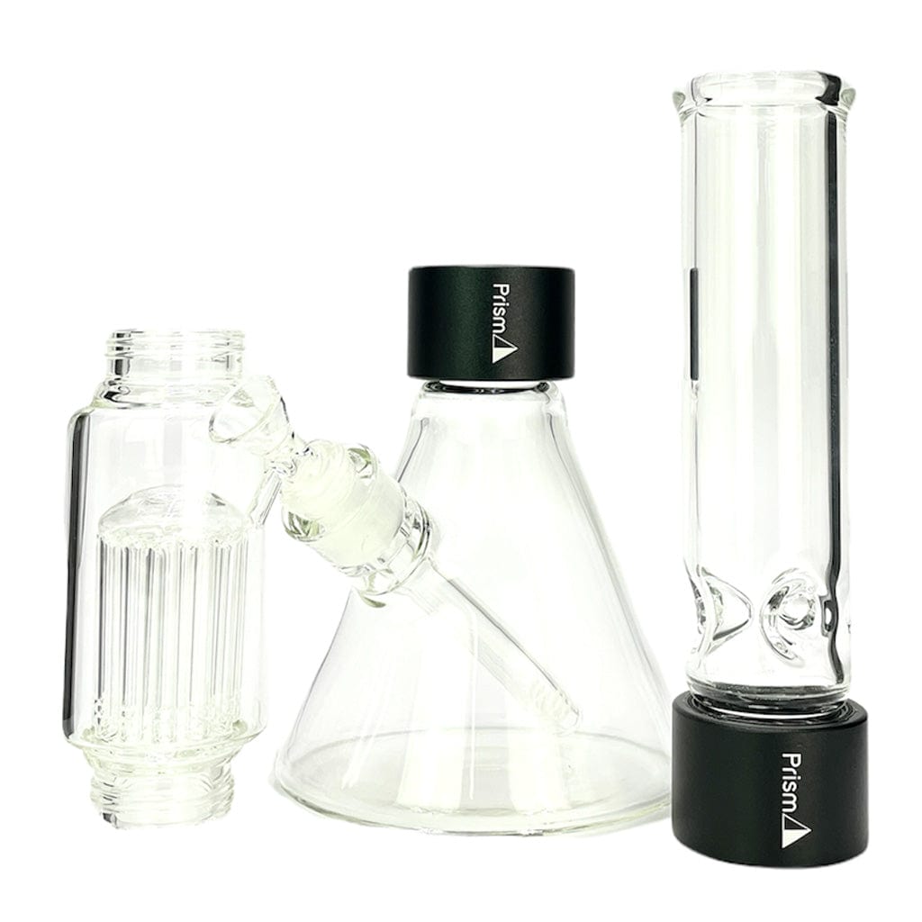 Front view of the Prism Beaker Double Stack showing three clear glass components with black branded caps against a white background.