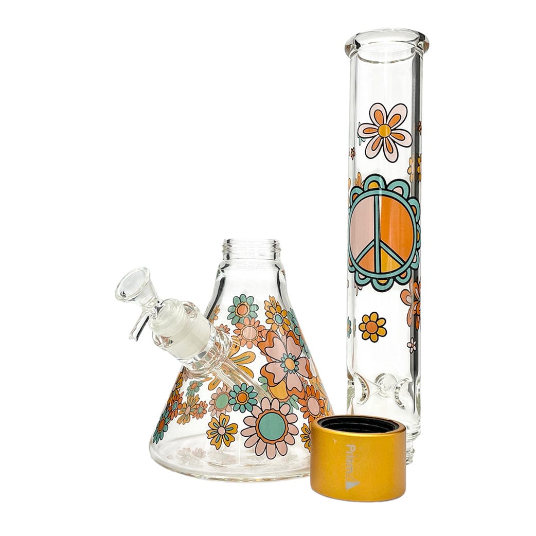 Three-quarter view of the Prism Flower Power Beaker Single Stack showing a floral-decorated beaker base, matching straight tube with a peace-sign motif, and a gold-colored stack ring.